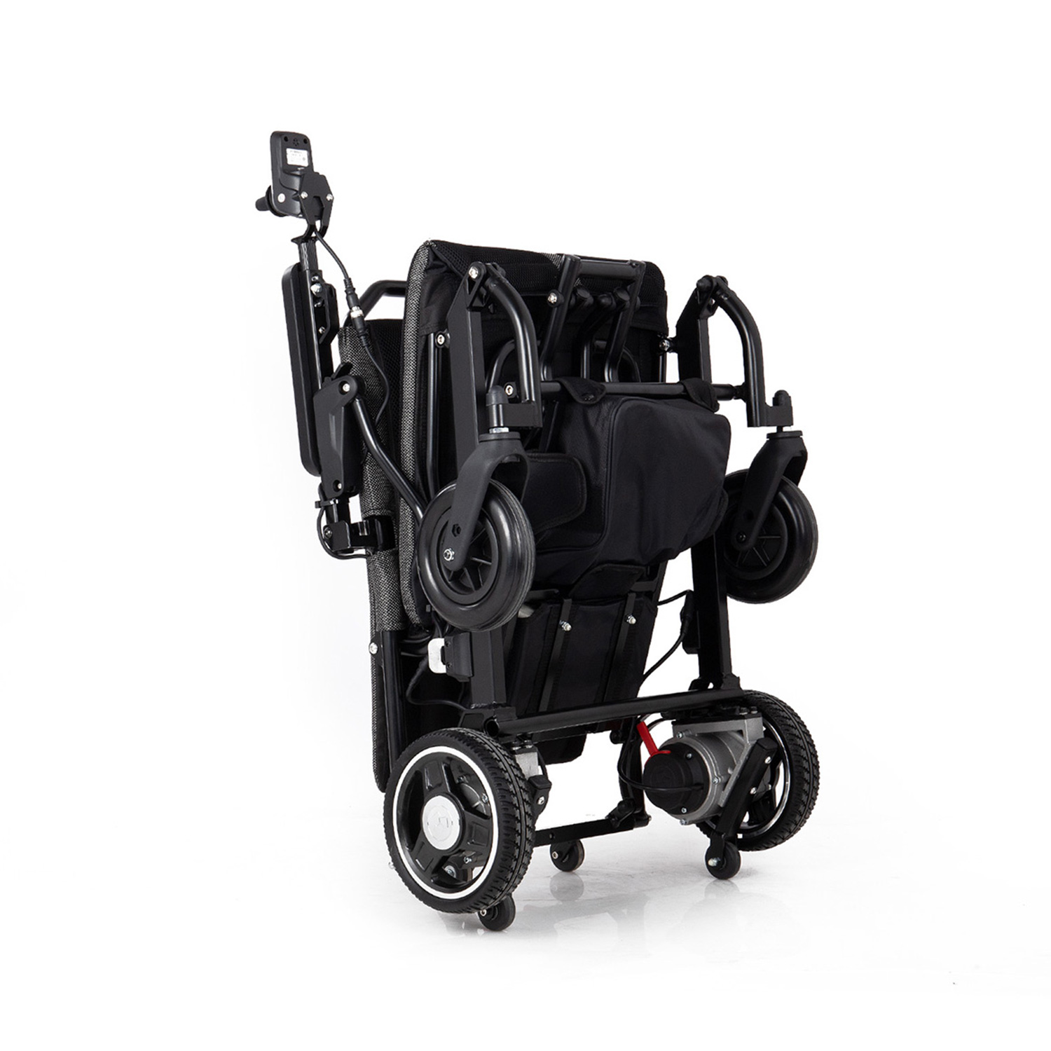 Foldable electric wheelchair collapsed and stored in a car trunk